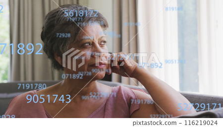 Image of numbers over senior african american woman Image of numbers over senior african american woman 116219024