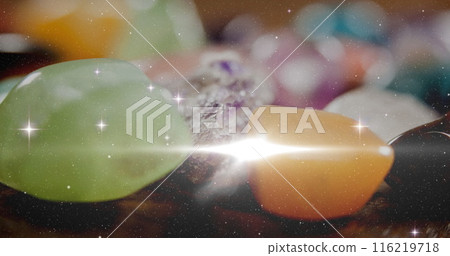 Image of stars and light spots over colourful stones, copy space 116219718