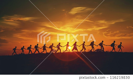 Group of people holding hands walking towards sunset 116219830