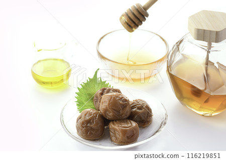 Kishu Nanko Plums Pickled in Honey (Honey Umeboshi) White Background Kishu Nanko Plums Pickled in Honey (Honey Umeboshi) White Background 116219851