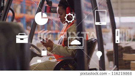 Image of media icons over african american female worker using smartphone in warehouse 116219868