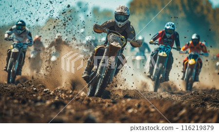 Group of motocross racers competing on muddy track Group of motocross racers competing on muddy track 116219879