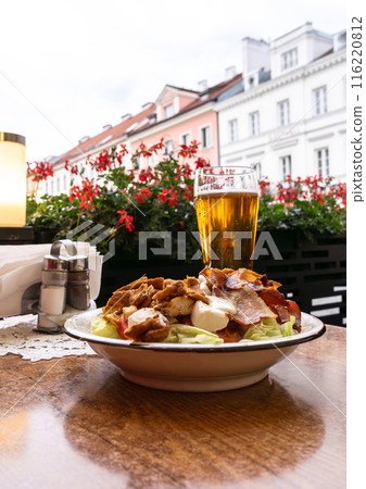 Polish Caesar salad with chicken, bacon and vegetables, high-calorie meat salad with fresh vegetables 116220812