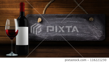 Image of lights over bottle and glass of red wine over wooden background with tag 116221230