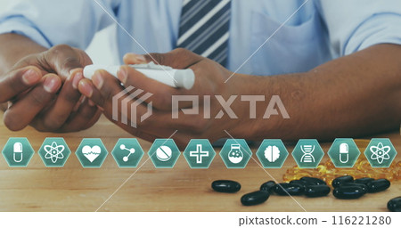 Image of medical icons over biracial male doctor 116221280