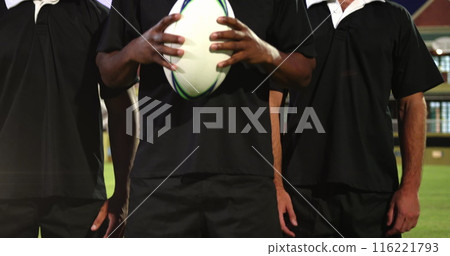 Image of glowing lights over diverse rugby players in sports stadium 116221793