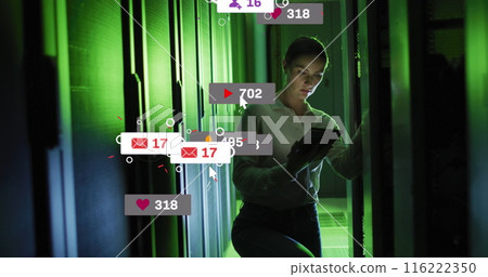 Image of social media icons and numbers over caucasian female it technician by computer server 116222350