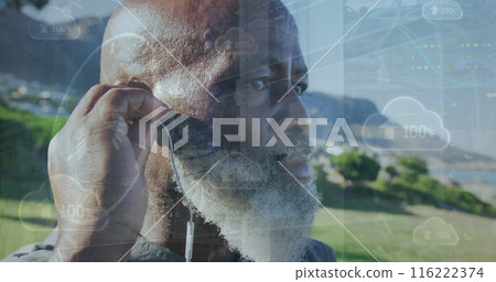 Image of data processing over close up of african american senior man wearing earphones outdoors 116222374