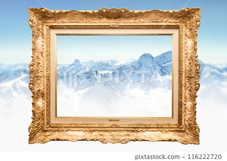 Wooden golden vintage painting frame over snowy mountain background. Concept of blending classic art with nature beauty 116222720
