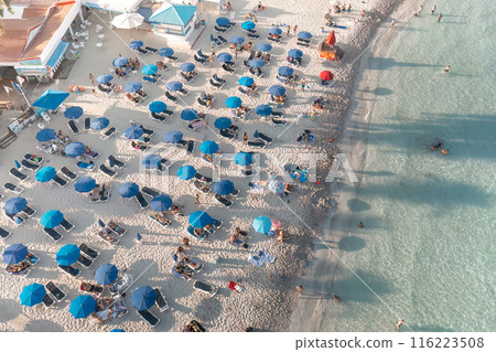 Aerial view of busy Nissi beach with sun umbrellas. Ayia Napa, Cyprus 116223508