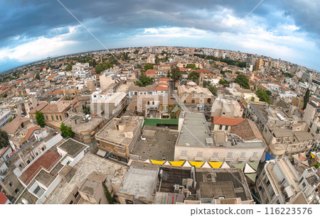 Nicosia city skyline panorama showing traditional houses and buildings under a cloudy sky 116223576