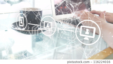 Person with light skin typing on laptop with coffee cup nearby Person with light skin typing on laptop with coffee cup nearby 116224016