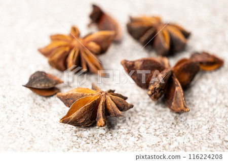Spice star anise closeup on gray stone background Spice star anise closeup on gray stone background 116224208