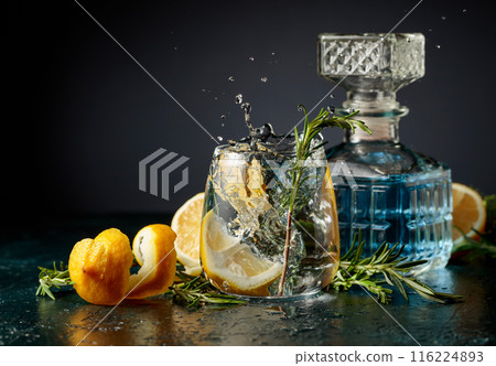 Gin tonic cocktail with lemon and rosemary. Gin tonic cocktail with lemon and rosemary. 116224893