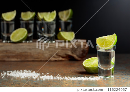 Tequila shots with lime and salt. Tequila shots with lime and salt. 116224967