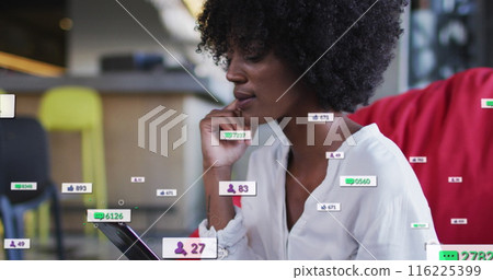 Image of social media icons over african american businesswoman 116225399