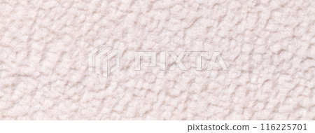 Texture of white fluffy woolen textile background from soft fleecy material, macro. Fabric with pattern. 116225701