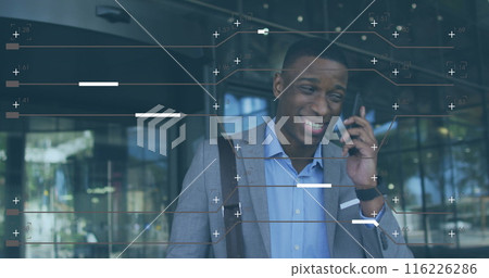Image of computer language and lines over african american businessman talking on cellphone 116226286