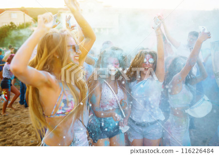 Teenagers Friends have fun at the holi festival. Beach Party. Celebrating traditional indian spring holiday. Teenagers Friends have fun at the holi festival. Beach Party. Celebrating traditional indian spring holiday. 116226484
