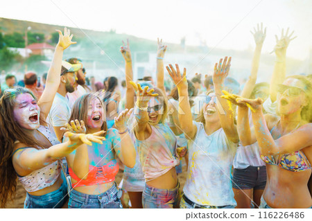 Teenagers Friends have fun at the holi festival. Beach Party. Celebrating traditional indian spring holiday. Teenagers Friends have fun at the holi festival. Beach Party. Celebrating traditional indian spring holiday. 116226486