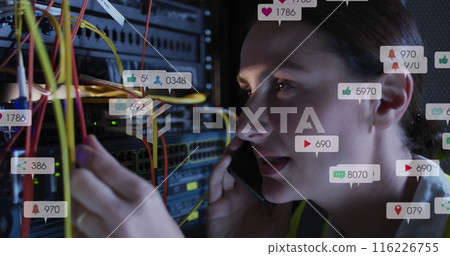 Image of social media icons over caucasian female engineer talking on smartphone at server room Image of social media icons over caucasian female engineer talking on smartphone at server room 116226755