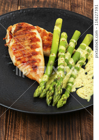 Grilled chicken breast with asparagus. Grilled chicken breast with asparagus. 116227391