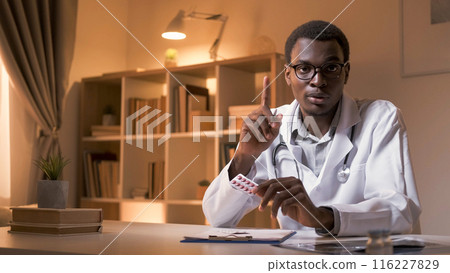 Prescription medication. Doctor consulting. Pharmaceutical telemedicine. Strict male physician ordering treatment pills at modern workplace interior with copy space. Prescription medication. Doctor consulting. Pharmaceutical telemedicine. Strict male physician ordering treatment pills at modern workplace interior with copy space. 116227829