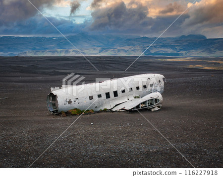 Aerial view of the Solheimasandur Plane Wreck in Iceland. Wrecked old plane Dakota on the black sand beach, south coast of Iceland 116227918