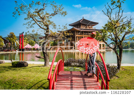 Asian girl in kimono and umbrella in Japanese theme park Hinoki Land in Chai Prakan District, Chiang 116228107