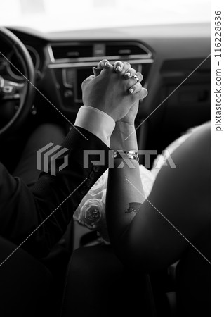Wedding. Hands of the newlyweds. The hands of a couple in love. Wedding. Hands of the newlyweds. The hands of a couple in love. 116228636