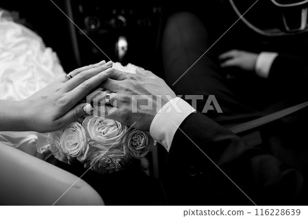 Wedding. Hands of the newlyweds. The hands of a couple in love. 116228639
