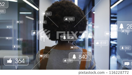 Image of media icons over african american businesswoman in office Image of media icons over african american businesswoman in office 116228772