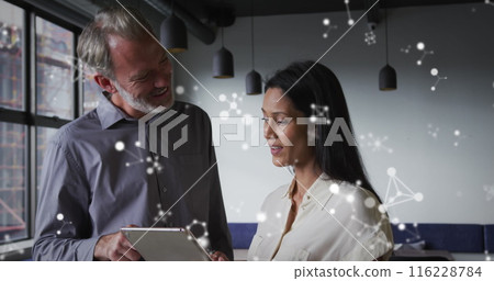 Image of molecular structures floating against diverse man and woman discussing at office 116228784