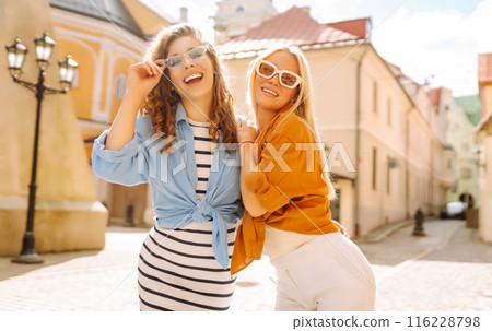Laughing woman enjoying weekend together. Summer playful mood concept. 116228798