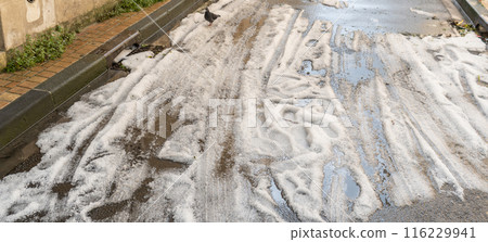 Big Hails after Hailstorm, Ice Hail on Street, Large Hailstone Damage, Big Ice Balls, Natural Disaster 116229941