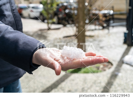 Big Hails after Hailstorm, Ice Hail on Street, Large Hailstone Damage, Big Ice Balls, Natural Disaster 116229943