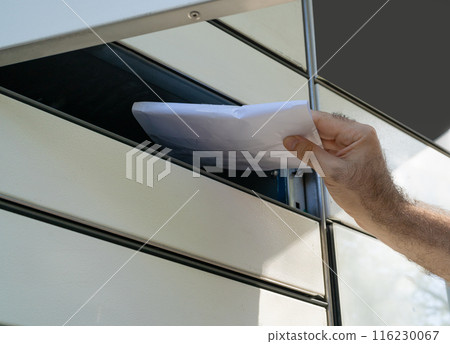 InPost parcel locker branding, modern delivery system, organized compartments, outdoor setting, editorial image 116230067