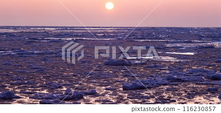 Sunset over the ice-covered sea of Okhotsk, Cape Shiretoko, Hokkaido Sunset over the ice-covered sea of Okhotsk, Cape Shiretoko, Hokkaido 116230857