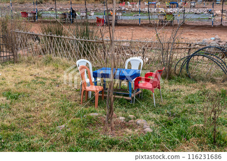 Restaurant Table in Moroccan Cafe, Cheap Plastic Empty Cafe Tables, Authentic Exotic Bistro Seat 116231686