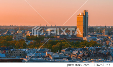 Aerial panoramic sunset over Riga old town in Latvia. Beautiful spring sunset over Riga. Golden hour fire sunset. 116231963