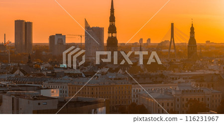 Aerial panoramic sunset over Riga old town in Latvia. Beautiful spring sunset over Riga. Golden hour fire sunset. 116231967