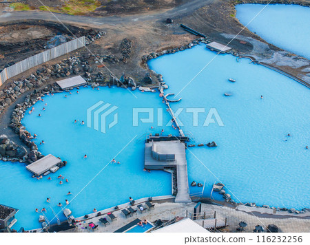 Aerial view of the Blue lagoon in Iceland. The most famous and popular SPA place in Iceland. Landscape from air. Vacation image. Blue and hot water in geothermal lake. Aerial view of the Blue lagoon in Iceland. The most famous and popular SPA place in Iceland. Landscape from air. Vacation image. Blue and hot water in geothermal lake. 116232256