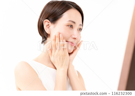 Woman looking in the mirror, beauty, moisture Woman looking in the mirror, beauty, moisture 116232300