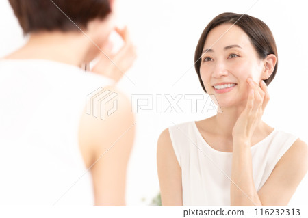 Woman looking in the mirror, beauty, moisture Woman looking in the mirror, beauty, moisture 116232313