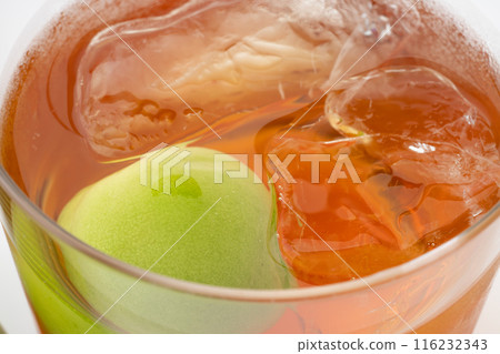 Close-up of plum wine on the rocks in a glass Close-up of plum wine on the rocks in a glass 116232343