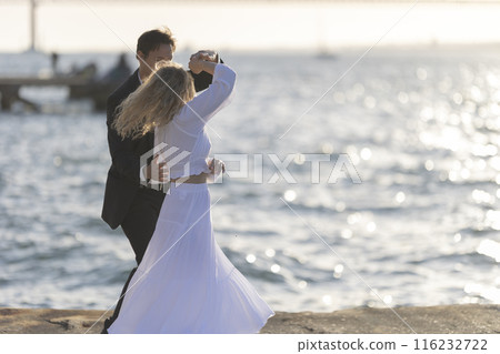 Couple Dancing at Sunset by the Sea Couple Dancing at Sunset by the Sea 116232722