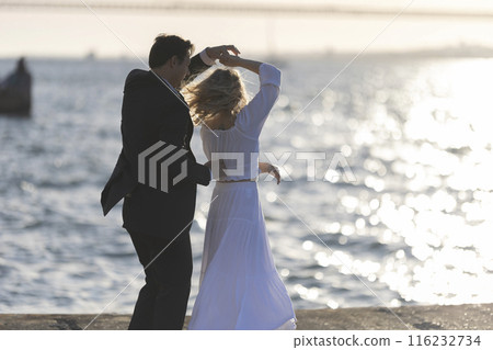 Couple Dancing at Sunset by the Sea Couple Dancing at Sunset by the Sea 116232734