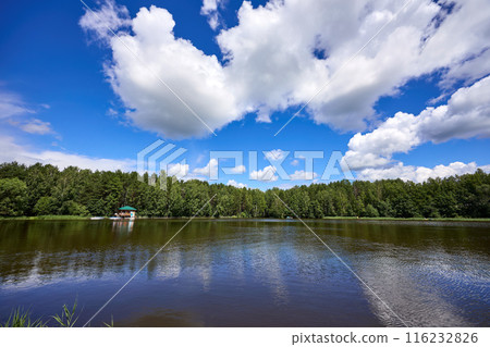 Beautiful summer river at sunny day with clouds reflection in the water Beautiful summer river at sunny day with clouds reflection in the water 116232826