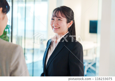 A woman looking for a job visiting an office 116233075