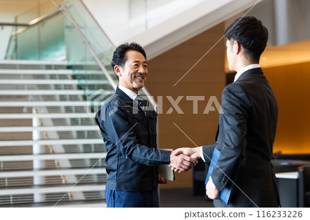 Business owner shaking hands 116233226